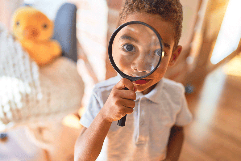 child-looking-through-magnifying-glass