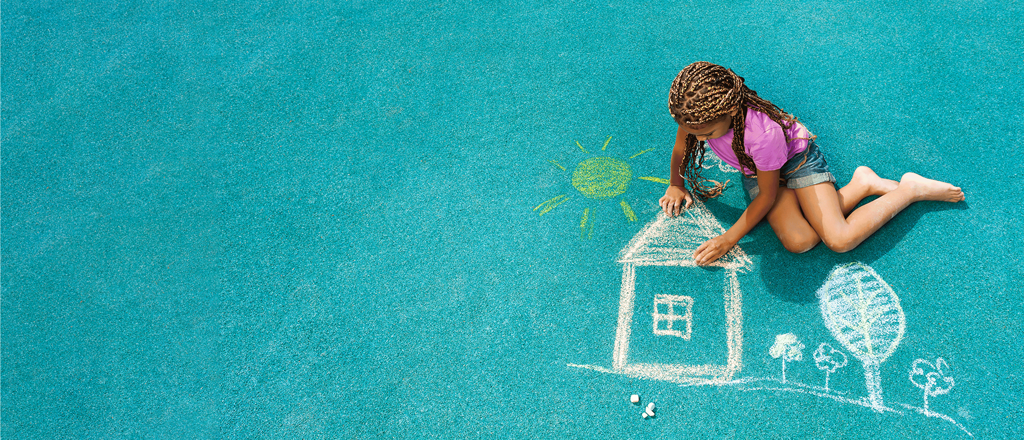 home-loan-grants-image-of girl-drawing-home-in-chalk